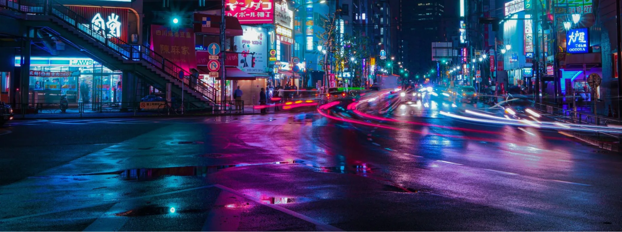 A busy street in Tokyo at night